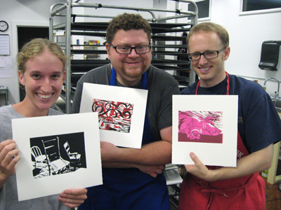 Jennie Hanzlik, Craig Kehl and Jeremy Gates proudly display their successful single and two color relief prints created during the 3 session relief printmaking workshop held in July.